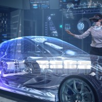 Automotive Female Professional Engineer working on design of Electric Car using Futuristic Augmented Reality Headset.